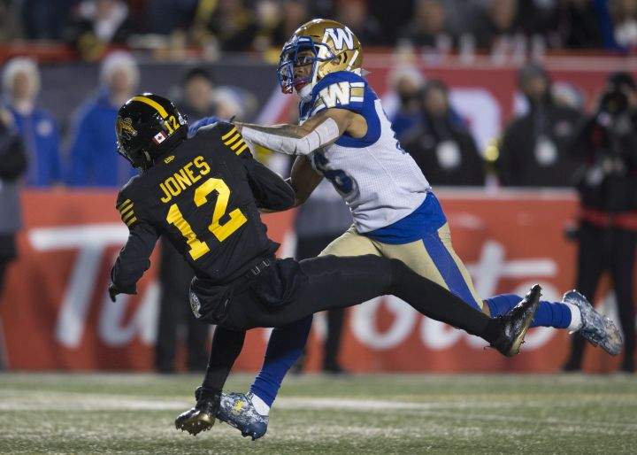 Winnipeg Blue Bombers' Mike Jones tackles Hamilton Tiger-Cats' Mike Jones during the second half of the 107th Grey Cup in Calgary, Alta., Sunday, November 24, 2019. 