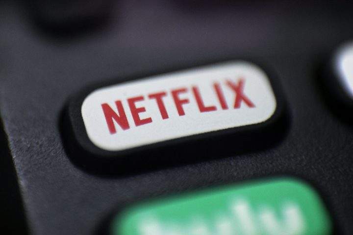 This Aug. 13, 2020, file photo shows a logo for Netflix on a remote control in Portland, Ore.