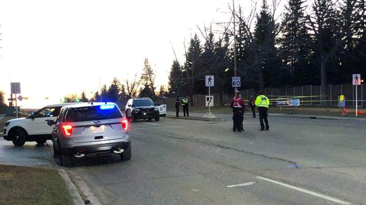Police respond to a collision at 90 Avenue and Bay View Drive S.W. on Wednesday night.