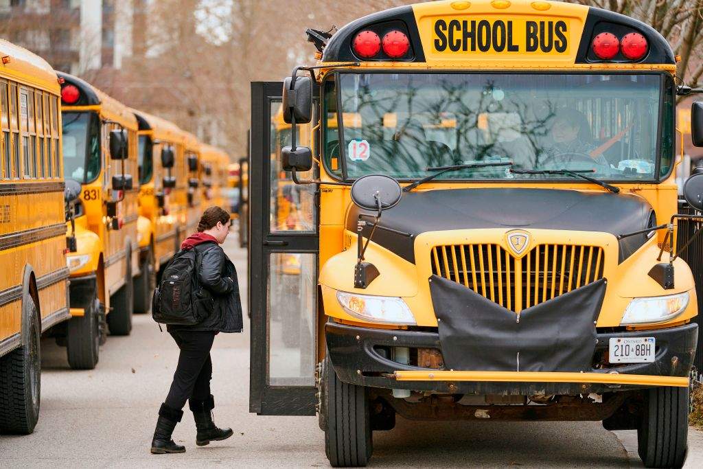 FILE - High school students leave Beal Secondary School in London, Ontario on March 13, 2020.