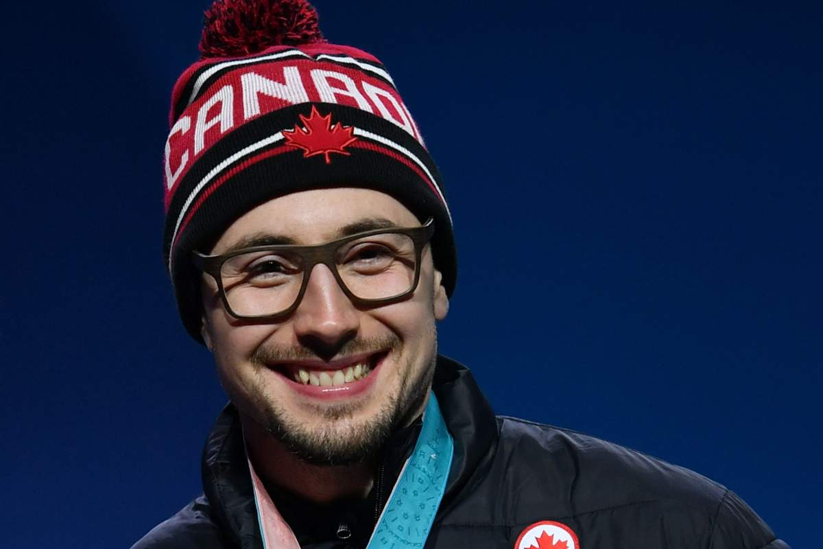 Canada gold medallist Alexander Kopacz poses on the podium during the medal ceremony for the 2-man bobsleigh at the Pyeongchang Medals Plaza during the Pyeongchang 2018 Winter Olympic Games in Pyeongchang on February 20, 2018.
