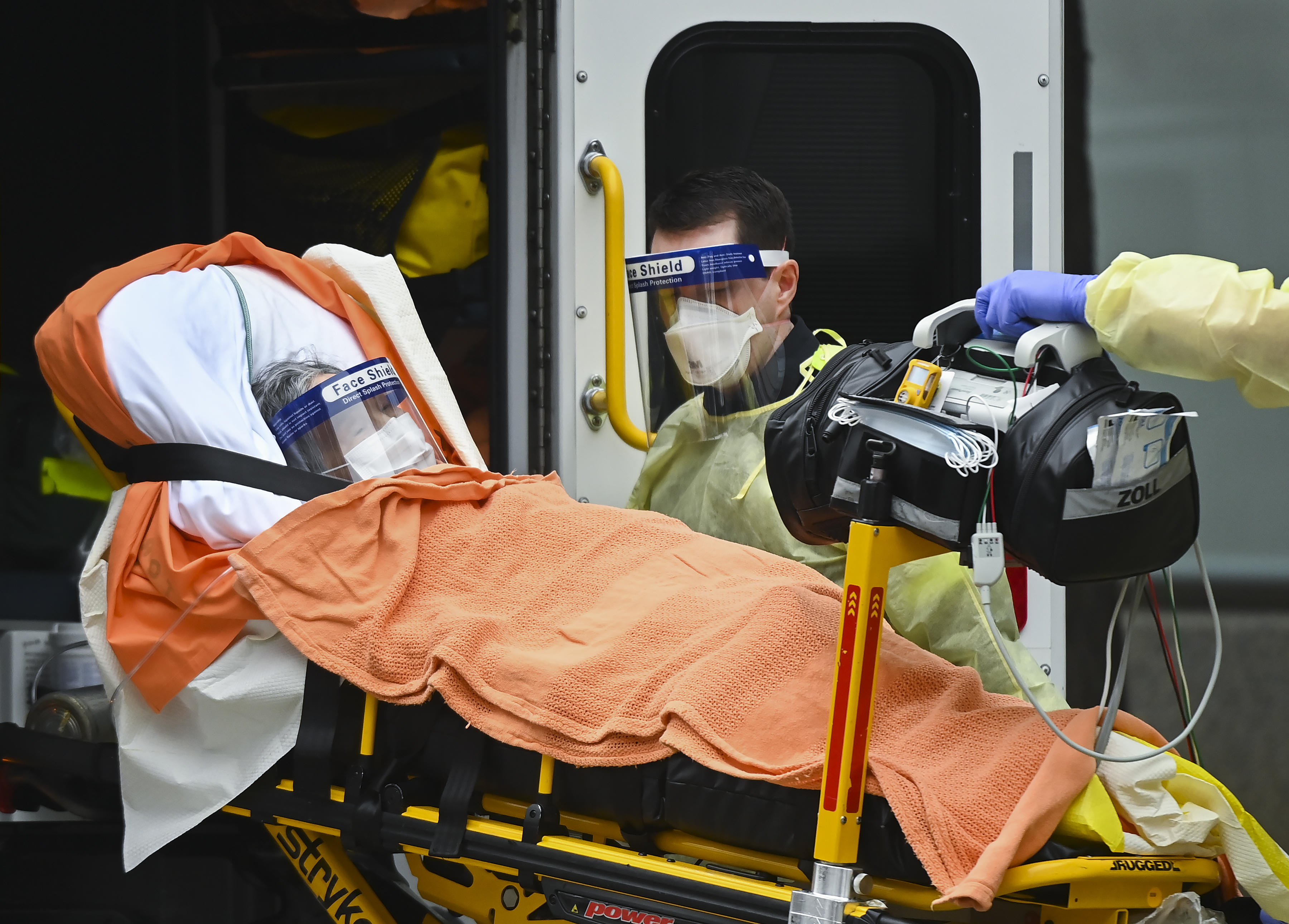 Paramedics take away an elderly patient at the Tendercare Living Centre, long-term-care facility during the COVID-19 pandemic in Scarborough, Ont., on Wednesday, December 23, 2020. Nearly half of its 254 residents along with 47 staff members so far have tested positive for the coronavirus. THE CANADIAN PRESS/Nathan Denette.