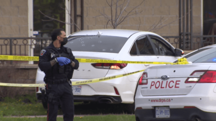 Bullet holes are seen in the back window of a vehicle after a shooting in Ajax on Wednesday.