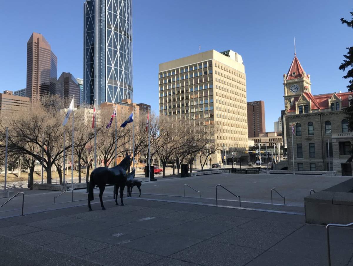A view of Calgary's downtown with historic city hall, taken from the steps of the city's municipal building, pictured on April 26, 2021.