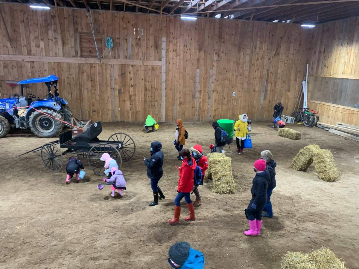 Kids take part in an indoor egg hunt on Sunday.