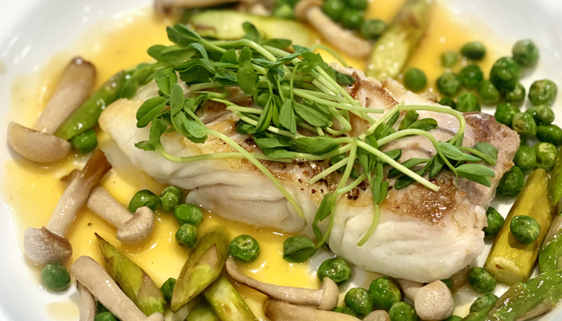 Fresh Pacific halibut with orange burre blanc.
