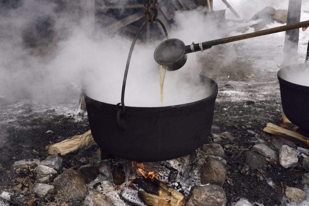 This file photo shows sap being boiled to make maple syrup.