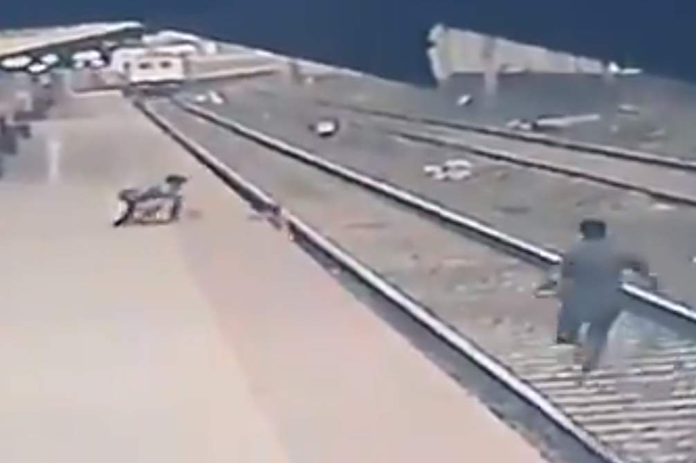 A boy is shown on the tracks at Vangani station in Mumbai on April 17, 2021, in this image from CCTV video.
