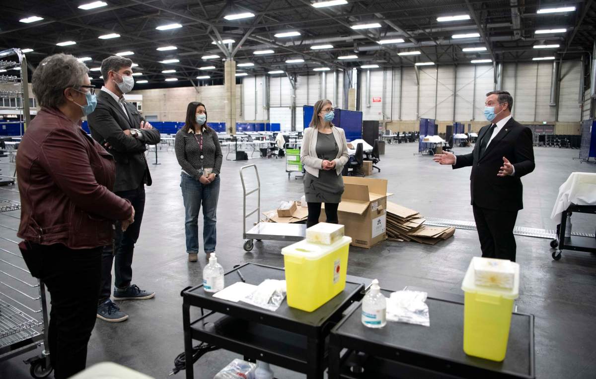 Premier Jason Kenney, chief medical officer Dr. Deena Hinshaw, and Edmonton mayor Don Iveson visited the Alberta Health Services rapid flow vaccination clinic at the Edmonton Expo Centre on Saturday, April 10, 2021.