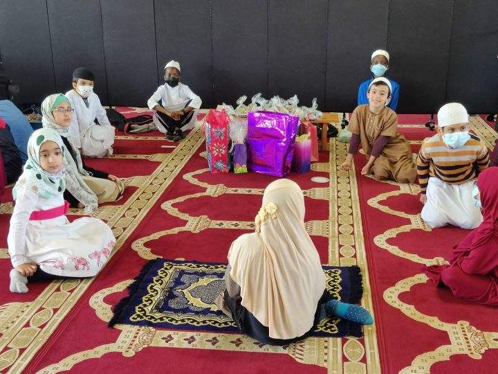 Children receive gifts ahead of Eid at Mosquee Madani in Montreal.