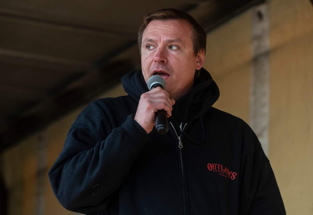 Chris Scott, owner of the Whistle Stop Café, speaks during a rally against measures taken by government and health authorities to curb the spread of COVID-19 at his café in Mirror, Alta., on Saturday, May 8, 2021.