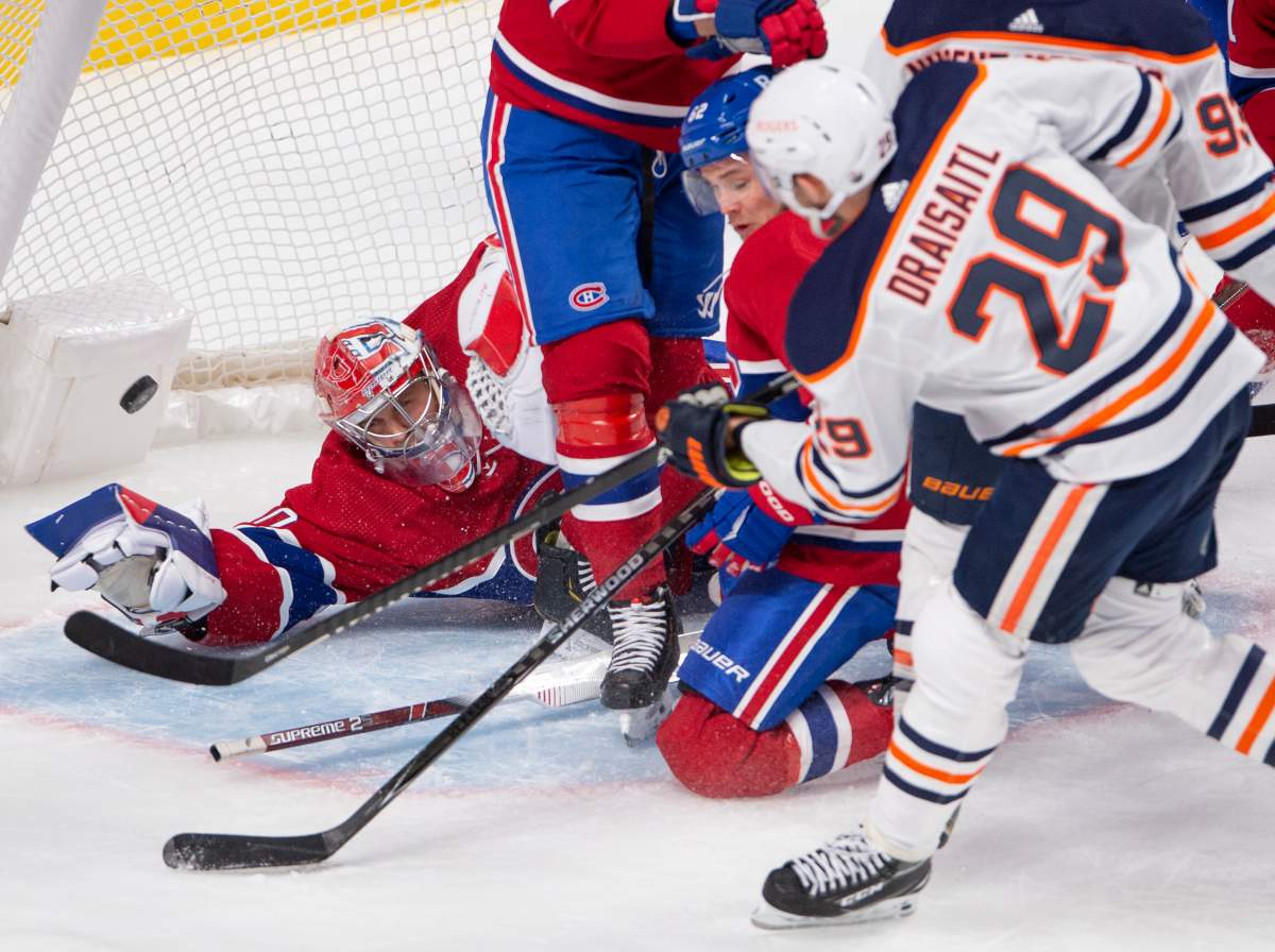 Edmonton Oilers’ Leon Draisaitl (29) scores the third goal against Montreal Canadiens goaltender Cayden Primeau (30) during second period NHL hockey action Wednesday, May 12, 2021 in Montreal.