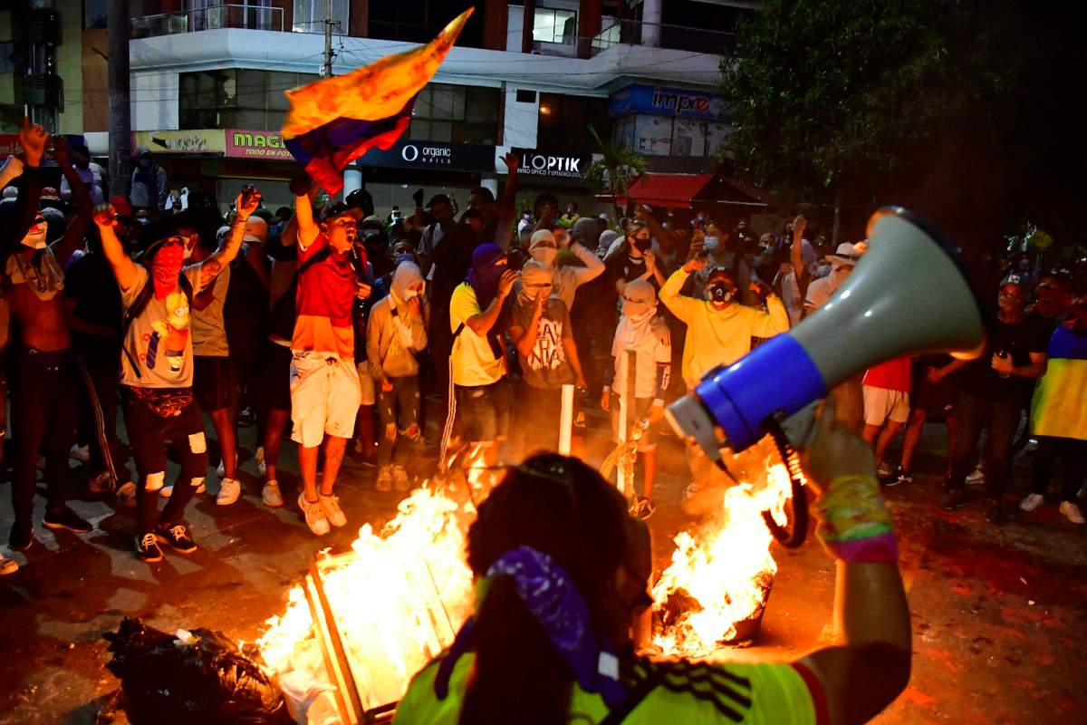 Anti-government protesters gather near Romelio Martinez stadium where a Copa Libertadores soccer match between Colombia’s América de Cali and Brazil’s Atlético Mineiro is being played in Barranquilla, Colombia, Thursday, May 13, 2021. (AP Photo)