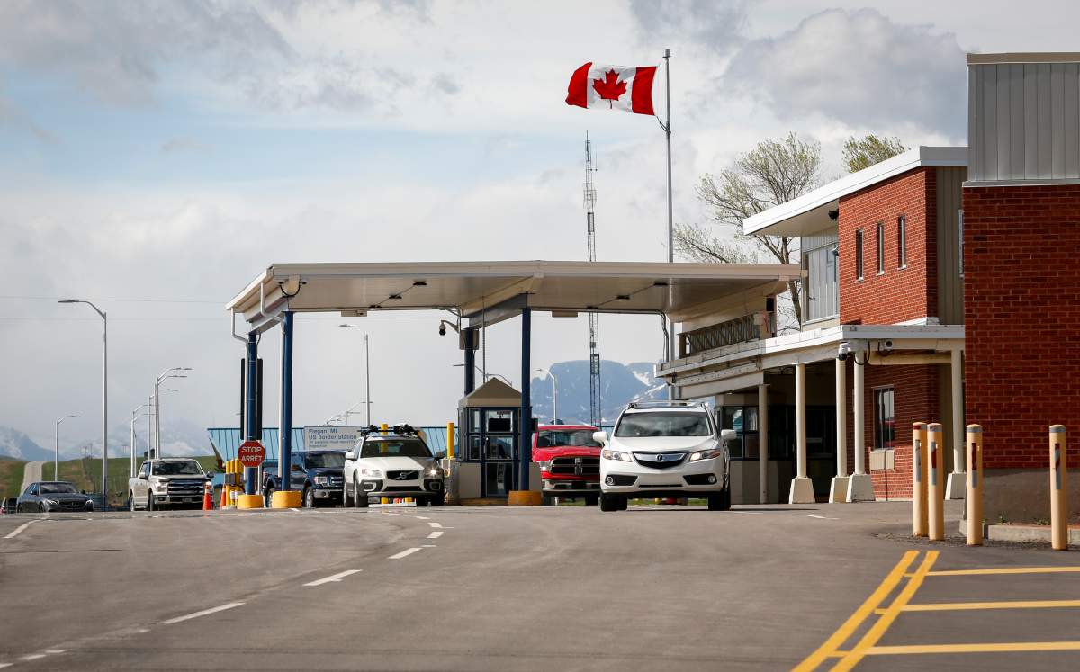 Southern Alberta residents return to Canada after getting shots of a COVID-19 vaccine from a Montana tribe in Carway, Alta., Tuesday, May 18, 2021.