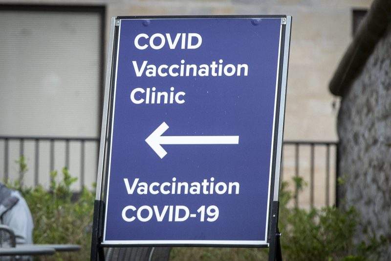 A sign for a COVID-19 vaccination clinic is shown. 