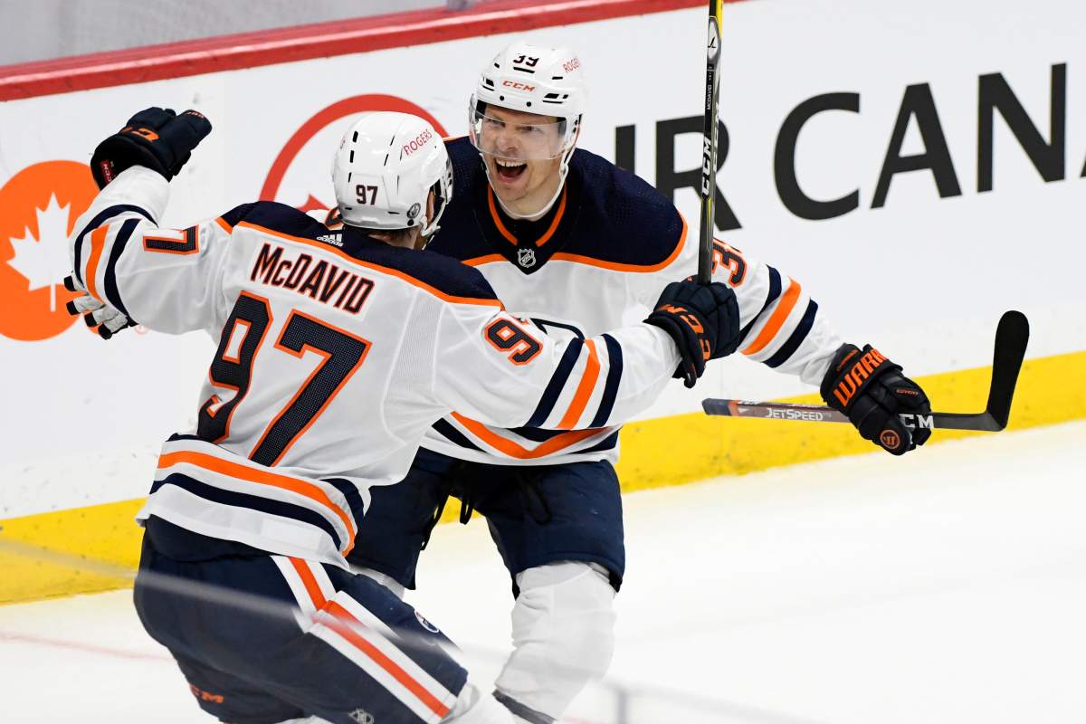 Edmonton Oilers’ Alex Chiasson (39) celebrates his goal with teammate Connor McDavid (97) during second period NHL Stanley Cup playoff action against the Winnipeg Jets, in Winnipeg on Monday, May 24, 2021.