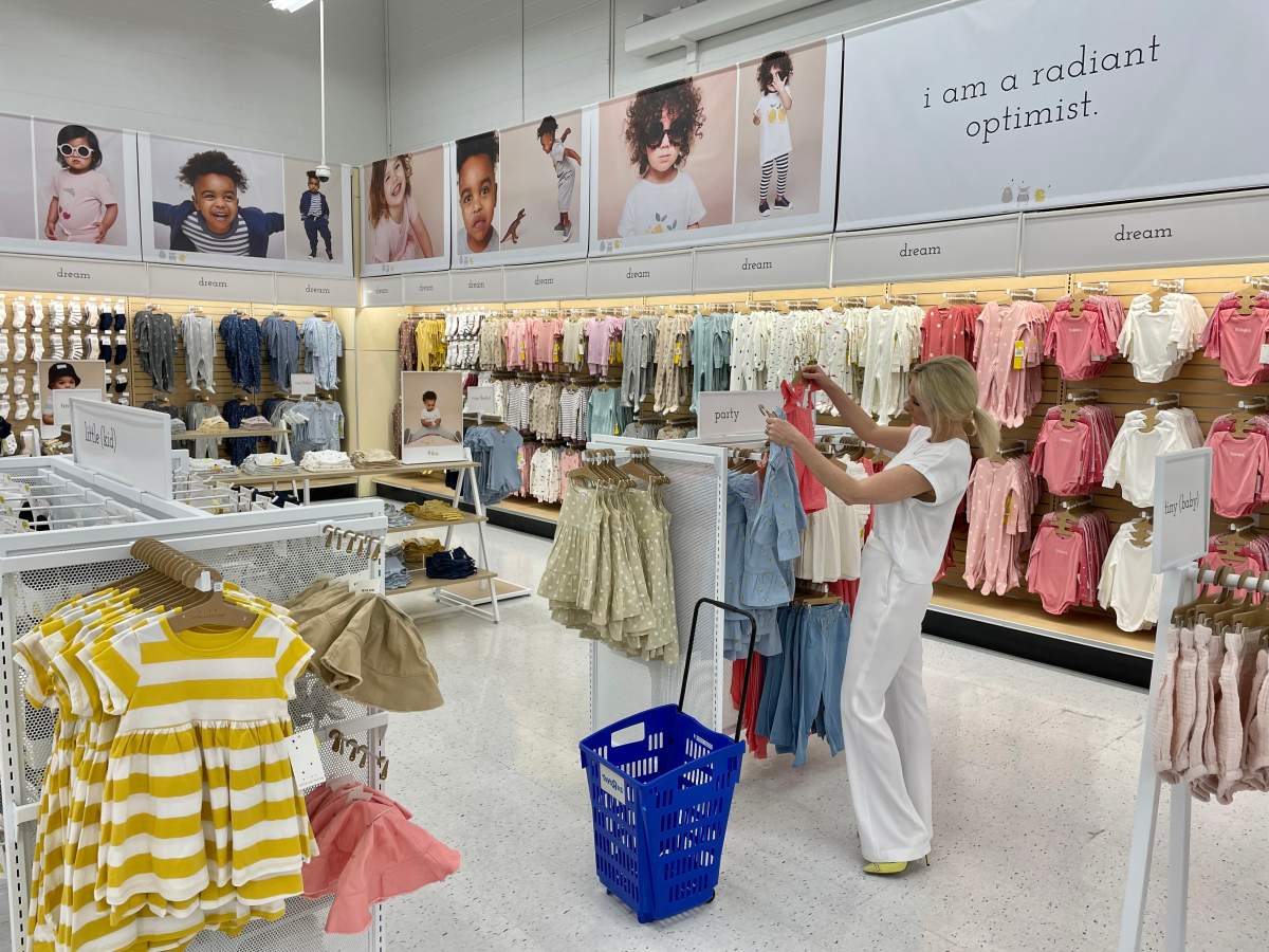 A woman looks at the new Rise Little Earthling kids clothing line at the Toys "R" Us store at the Sherway Gardens shopping mall in Etobicoke, Ont., on May 20, 2021, handout photo. Rise Little Earthling is a new apparel brand available at Toys "R" Us locations across Canada and online. THE CANADIAN PRESS/HO - Toys "R" Us *MANDATORY CREDIT*.