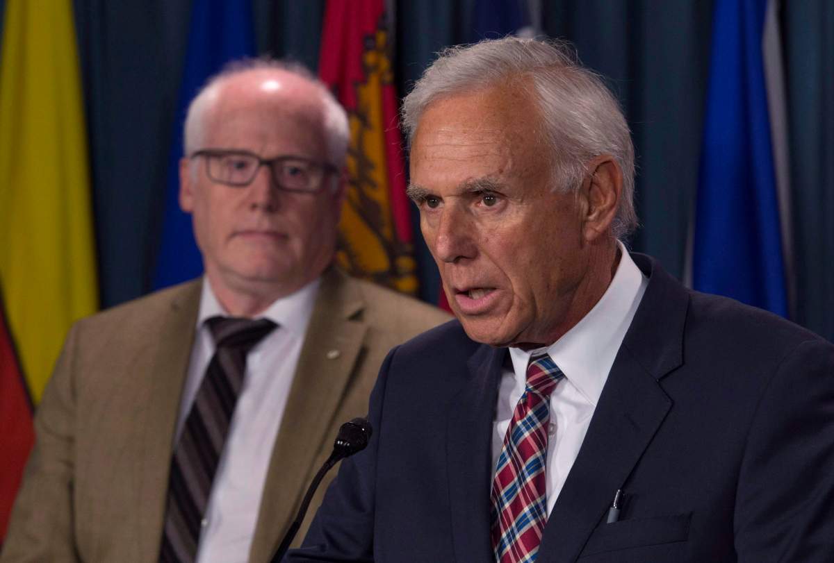 Amnesty Canada Secretary General Alex Neve (left) looks on as Donald Bayne, Hassan Diab’s lawyer, answers a question during a media availability in Ottawa, Wednesday, June 21, 2017.