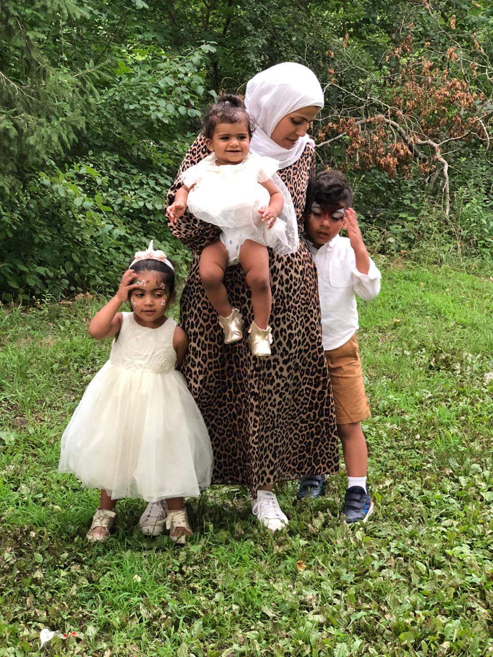 Photo of Rewand Almobayed and her three children.