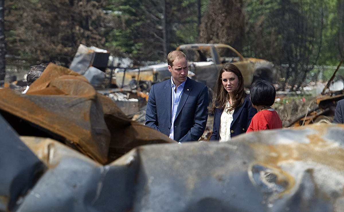 William and Catherine, the Duke and Duchess of Cambridge, tour the devastation with Mayor Karina Pillay and officials in Slave Lake, Alta., on Wednesday, July 6, 2011.