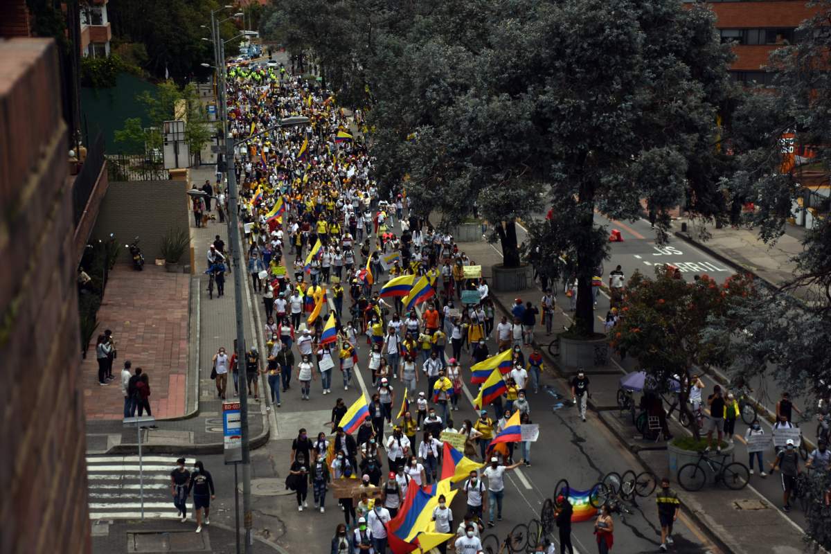 People march to stage a protest against the government in Bogota, Colombia on May 9, 2021.