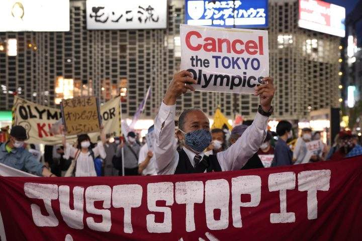 TOKYO, JAPAN: Protesters hold up a banner that reads, “Just Stop it” during an anti-Tokyo 2020 Olympic Games Rally in Ginza district on May 17, 2021