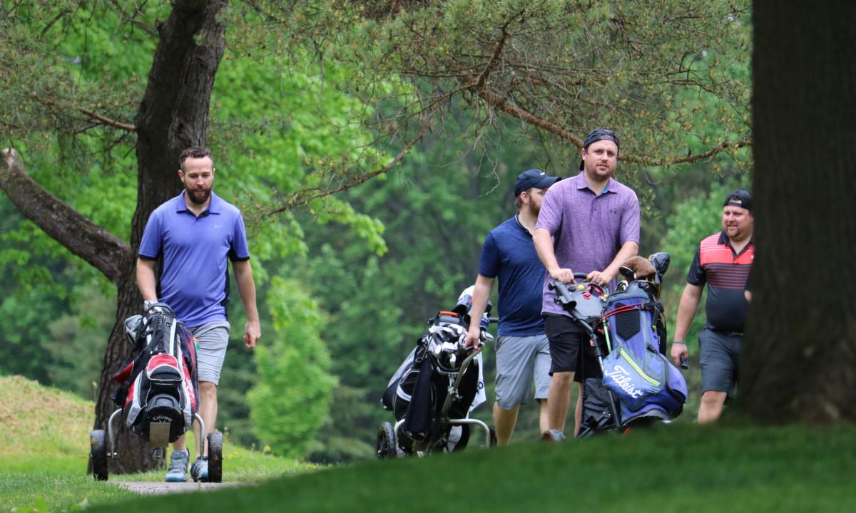 Golfers out enjoying the first day of golf courses being back open at East Park London on May 22, 2021.