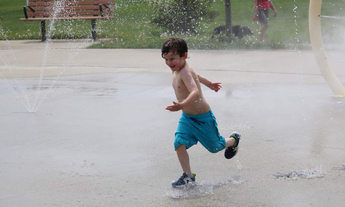 Noah Cooper, five, playing at a splash pad in London on Saturday after the province reopened them May 22, 2021