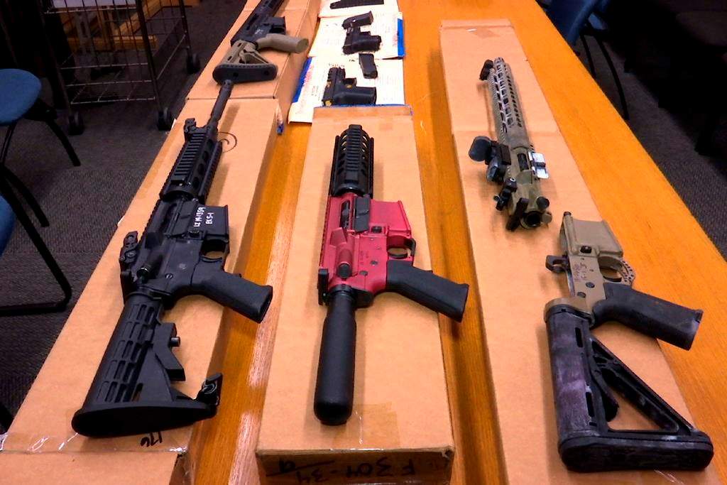 FILE - This Nov. 27, 2019, file photo shows "ghost guns" on display at the headquarters of the San Francisco Police Department in San Francisco. (AP Photo/Haven Daley, File).