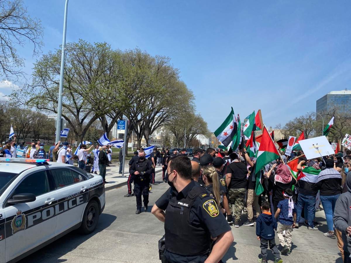 Pro-Palestinian and pro-Israel demonstrators met in front of Manitoba's legislative building Saturday afternoon.