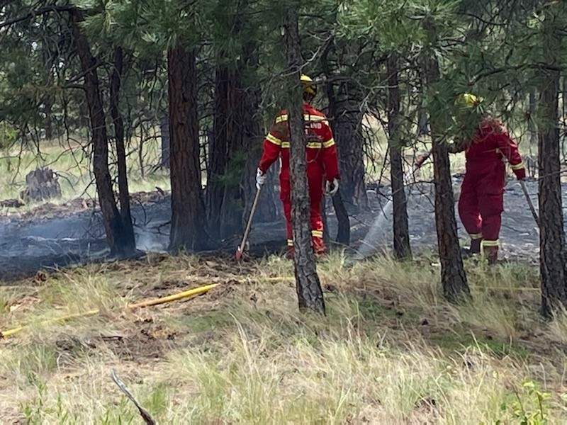 Another view of Peachland fire crews battling the small blaze.