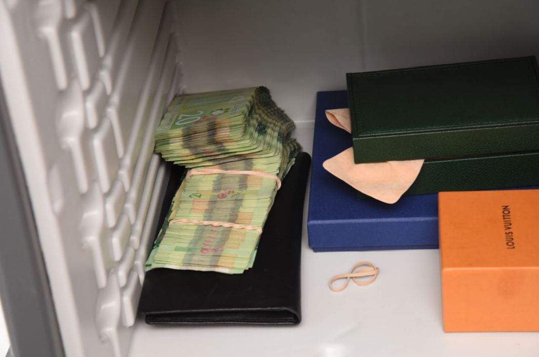 Stacks of $20 bills inside a safe in Mohammad Movassaghi’s penthouse suite