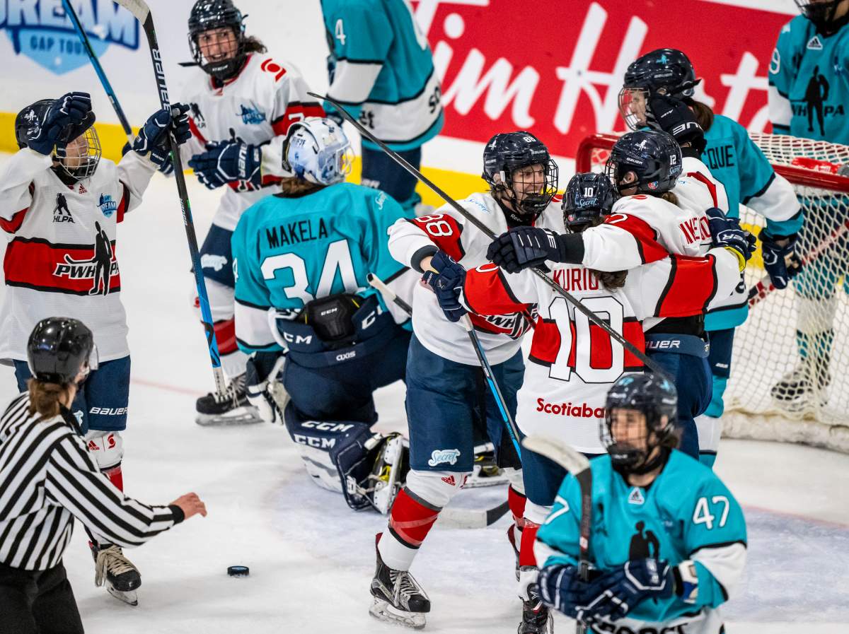 Iya Gavrilova (center) and Team Scotiabank celebrate during the Professional Women’s Hockey Players  Association (PWHPA) Secret Dream Gap Tour at the Seven Chiefs Arena on the  Tsuut’ina Nation on May 26, 2021. (Photo: Dave Holland/PWHPA).