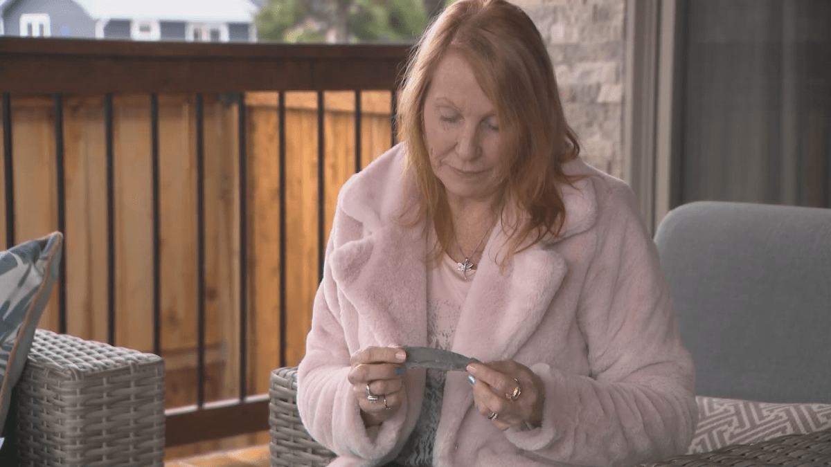 Fiona Williams, niece or Harry Farrington, with a part of the fuselage of BK 716. Screengrab from video shot by Trevor Owens.