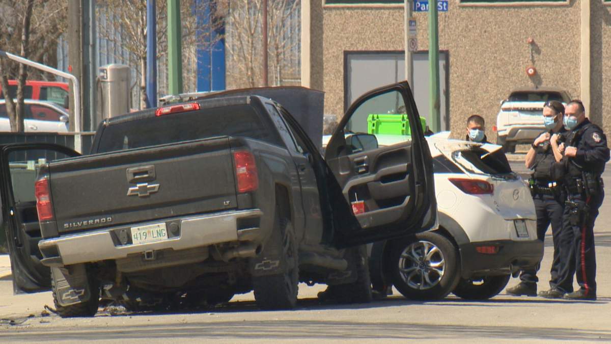 One man was taken to the hospital with serious injuries after a parked car he was standing next to was struck by a truck. 