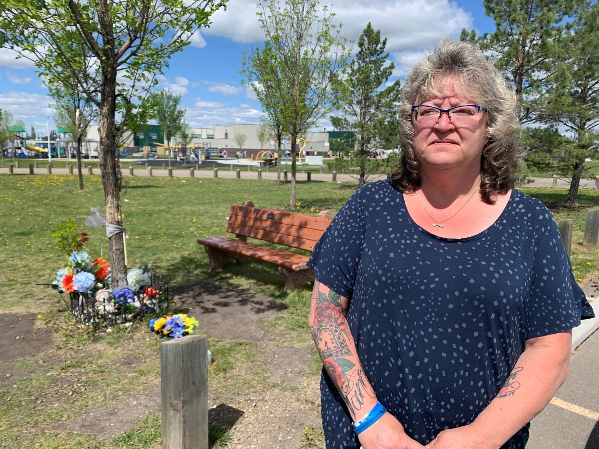 Kim Krupa stands outside Florence Hallock School, at a memorial for her son.