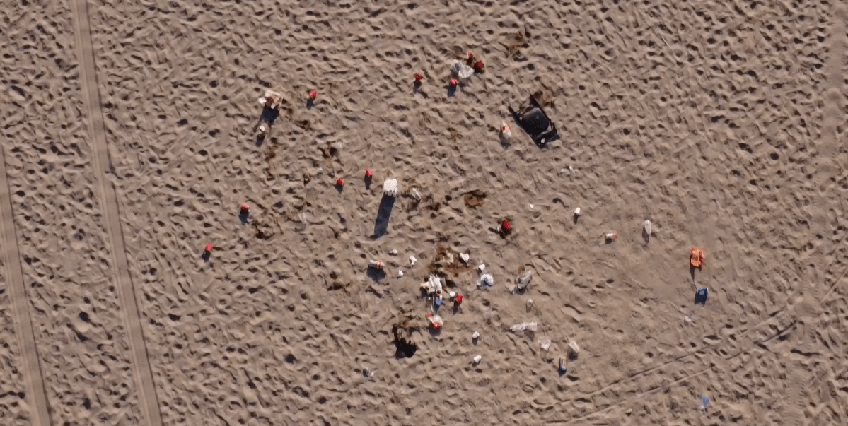 An aerial view of one mound of litter left behind on a Toronto beach following the Victoria Day long-wekend.