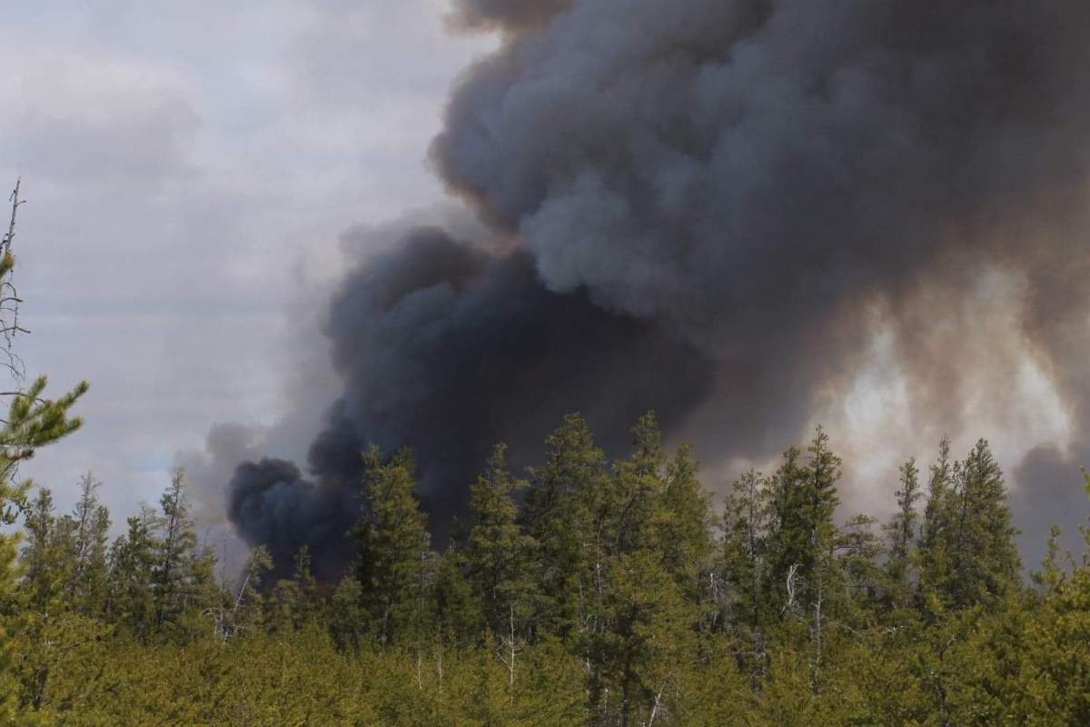A wildfire burns in the RM of Piney.