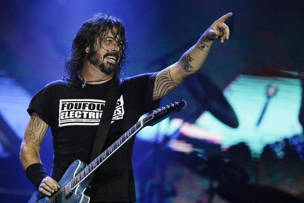 FILE - In this Sept. 29, 2019, file photo, Dave Grohl of the band Foo Fighters performs at the Rock in Rio music festival in Rio de Janeiro, Brazil. 