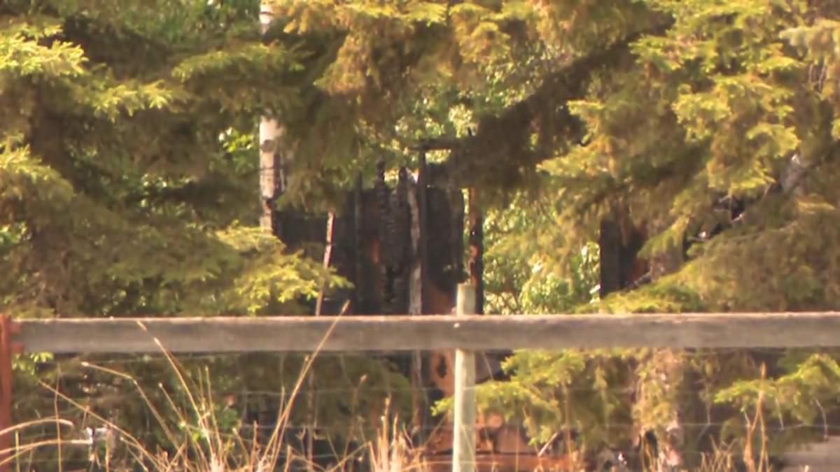 A burnt home on a rural property near Buck Lake, Alta. on Thursday, June 3, 2021.