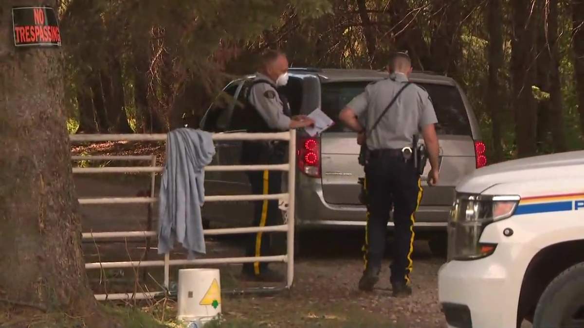 RCMP and a medical examiner’s vehicle at a rural property near Buck Lake, Alta. on Thursday, June 3, 2021.