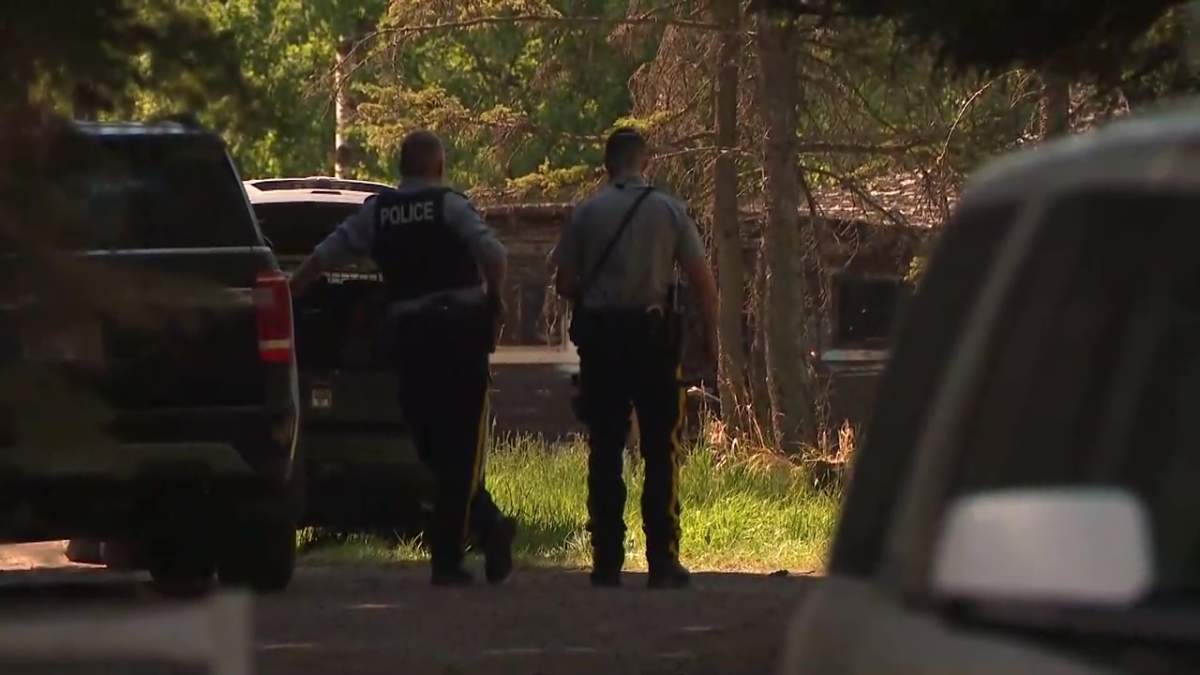 RCMP at a rural property near Buck Lake, Alta. on Thursday, June 3, 2021.