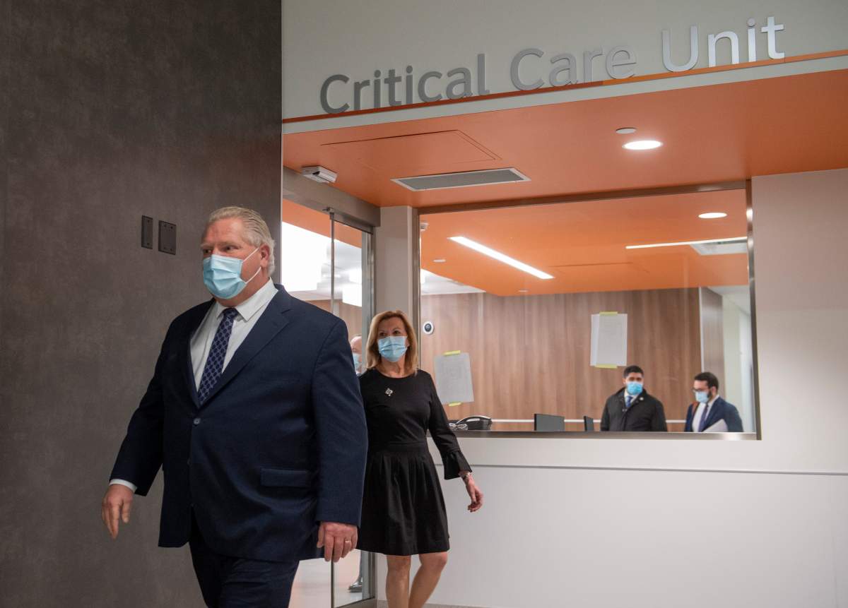 Ontario Premier Doug Ford and Health Minister Christine Elliot walk out after being given a tour of a digital Intensive Care Unit room at Cortellucci Vaughan Hospital in Vaughan, Ontario on Monday, January 18, 2021. 