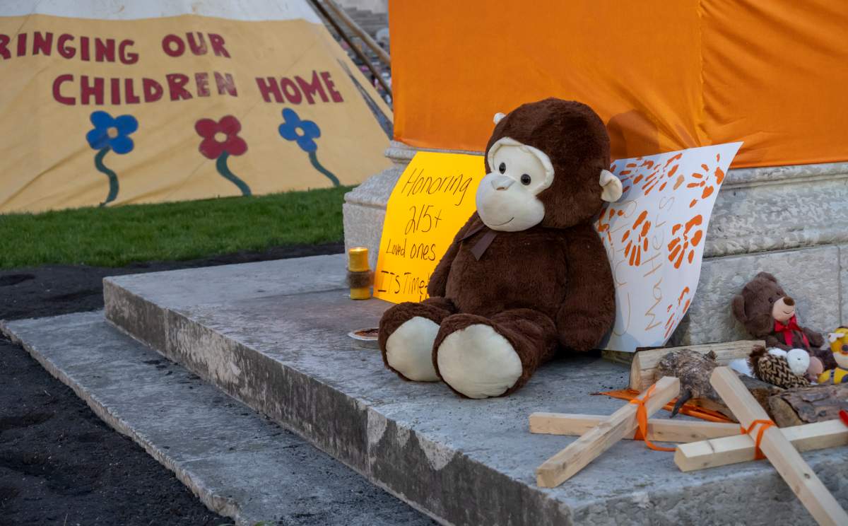 Manitobans honour the lives of 215 children found buried at former B.C. residential school.