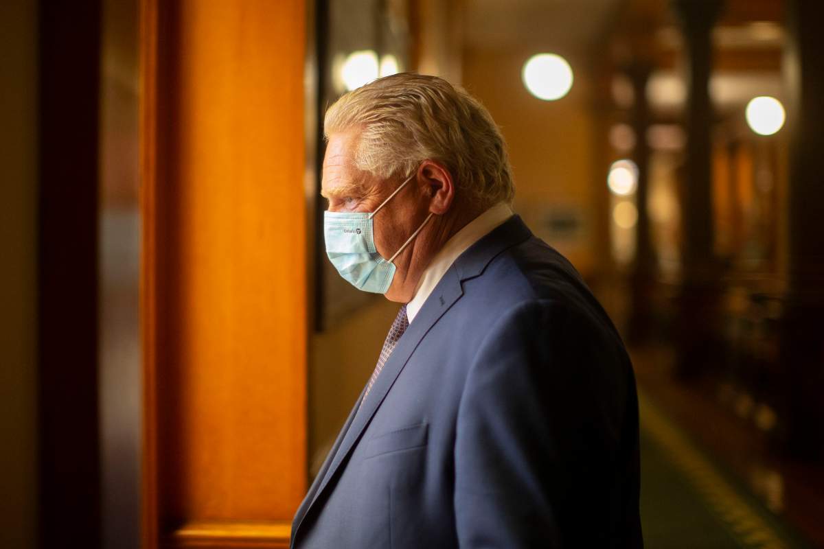 Ontario Premier Doug Ford walks to his office in the Queen's Park Legislature in Toronto on Monday, June 14, 2021.