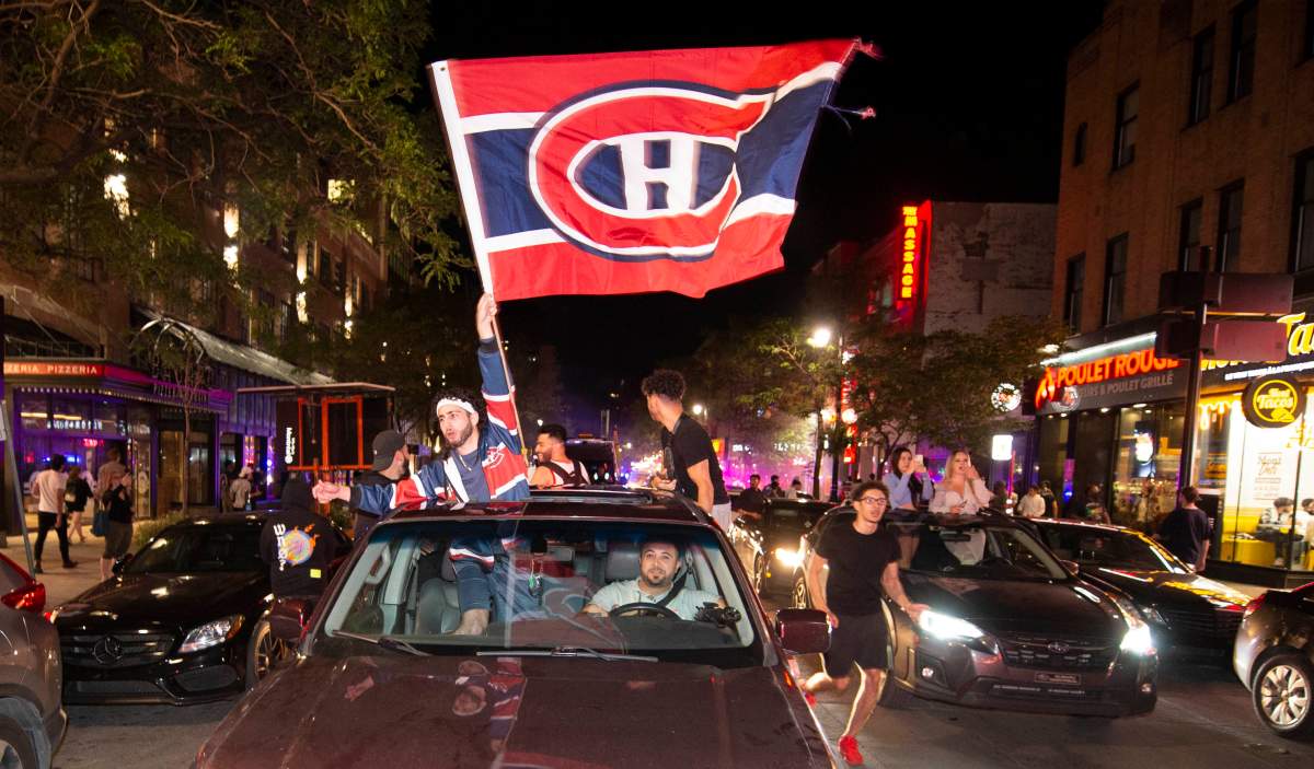 Montreal Canadiens fans celebrate on Rue Ste-Catherine after the Montreal Canadiens defeated the Vegas Golden Knights in overtime game 6 NHL Stanley Cup playoff hockey semifinal action in Montreal on Thursday.