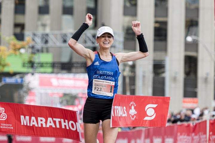 Dayna Pidhoresky celebrates after finishing the 2019 Scotiabank Toronto Waterfront Marathon as the top Canadian woman, in Toronto, on Sunday, Oct. 20, 2019.