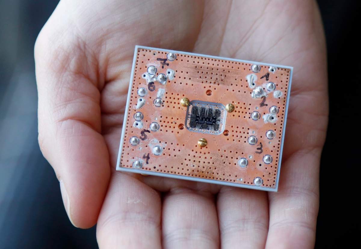 This Feb. 27, 2018, photo shows a seven cubit quantum device is seen at the IBM Thomas J. Watson Research Center in Yorktown Heights, N.Y. Describing the inner workings of a quantum computer isn't easy, even for top scholars. That's because the machines process information at the scale of elementary particles such as electrons and photons, where different laws of physics apply. 