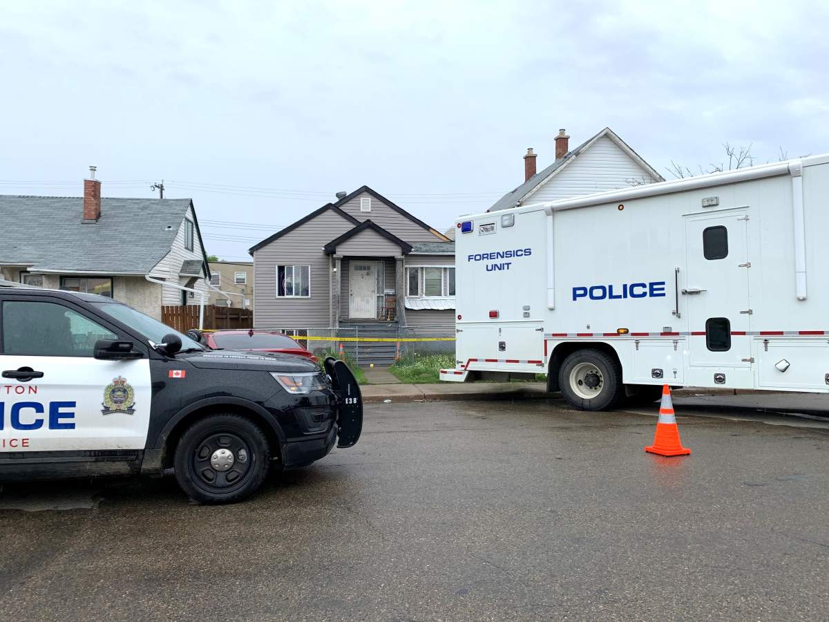 Edmonton police investigate a suspicious death at a home in the area of 98 Street and 108 Avenue, Wednesday, June 9, 2021.