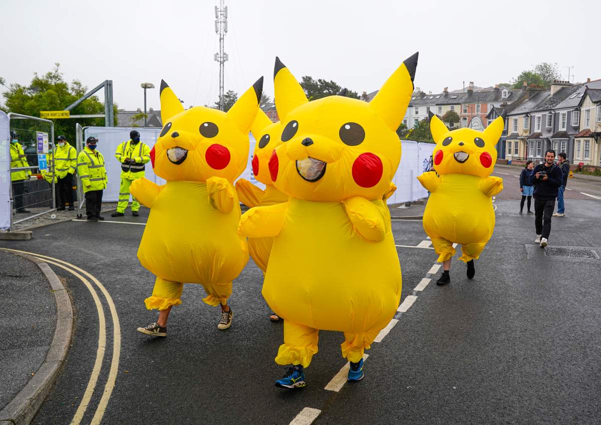 Protesters dressed as Pikachu characters demonstrate outside the G7 Summit media centre, calling on the Japanese government to stop burning coal by 2030, on June 11, 2021 in Falmouth,